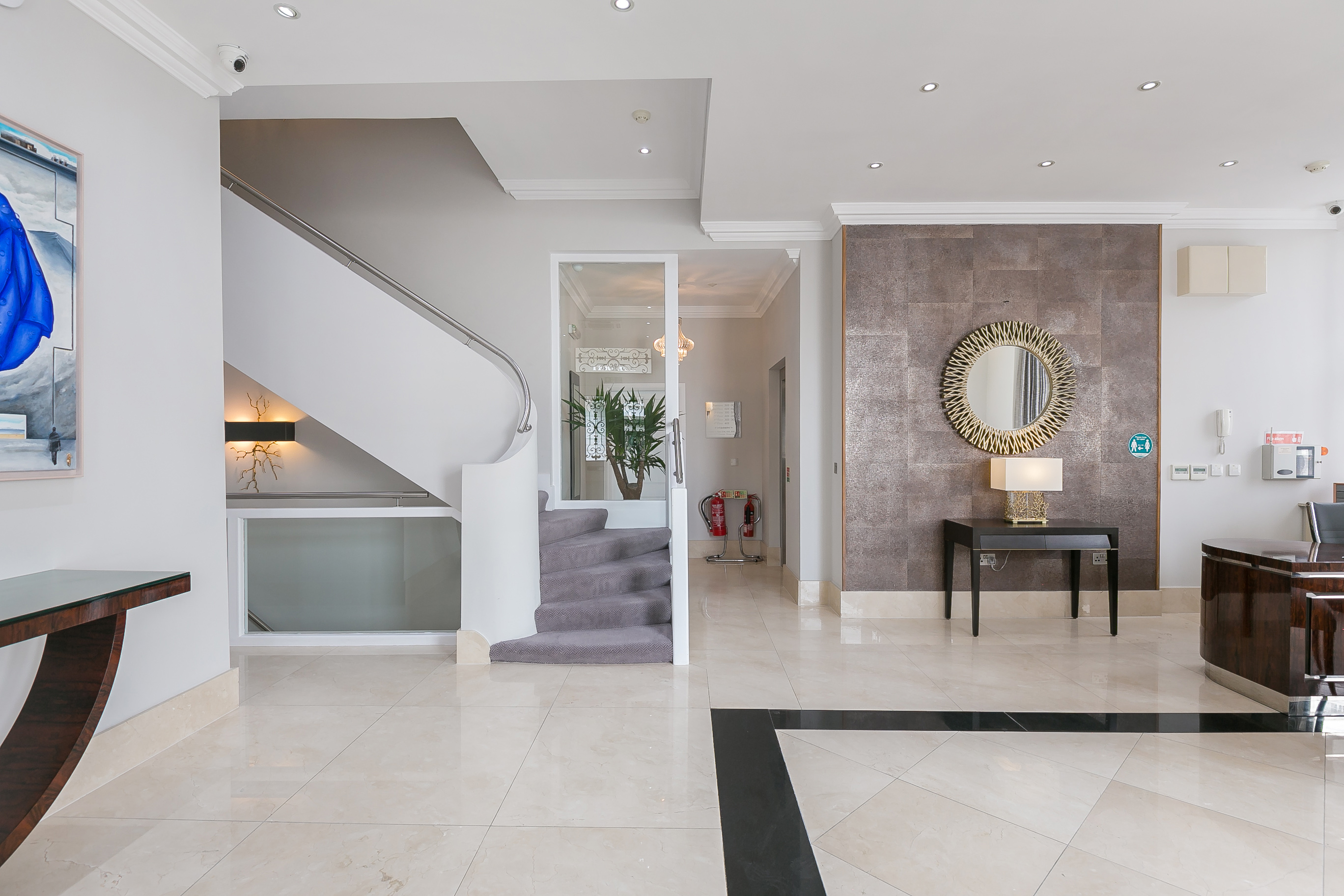 The entrance hall and staircase at Chilworth Court